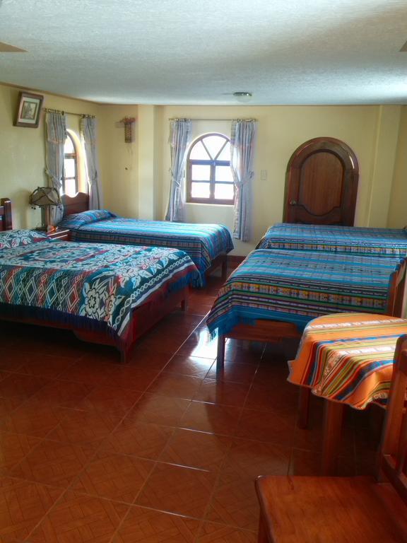 Hostal Curinan Отавало Номер фото